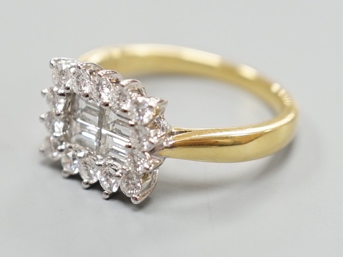 A 750 yellow metal, baguette and round cut diamond set rectangular cluster ring, size M, gross weight 4.8 grams.